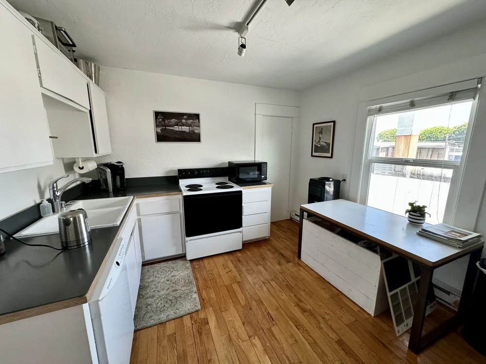 Kitchen with white cabinets and countertop workspace